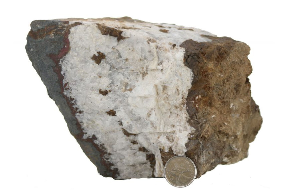 Barite-Quartz-Magnetite vein with hematized wall rock, boiling textures and oxidized suphides within the vein. This sample was hosted in Nicol Creek Basalts.
